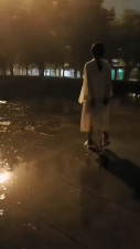 I walk in steel handcuffs in the rain.