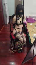 They play with a vibrator while tied up.