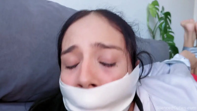 Secretary tapegagged over ballgag (SilencedCuties.com)