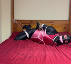 Crossdresser frogtied to bed