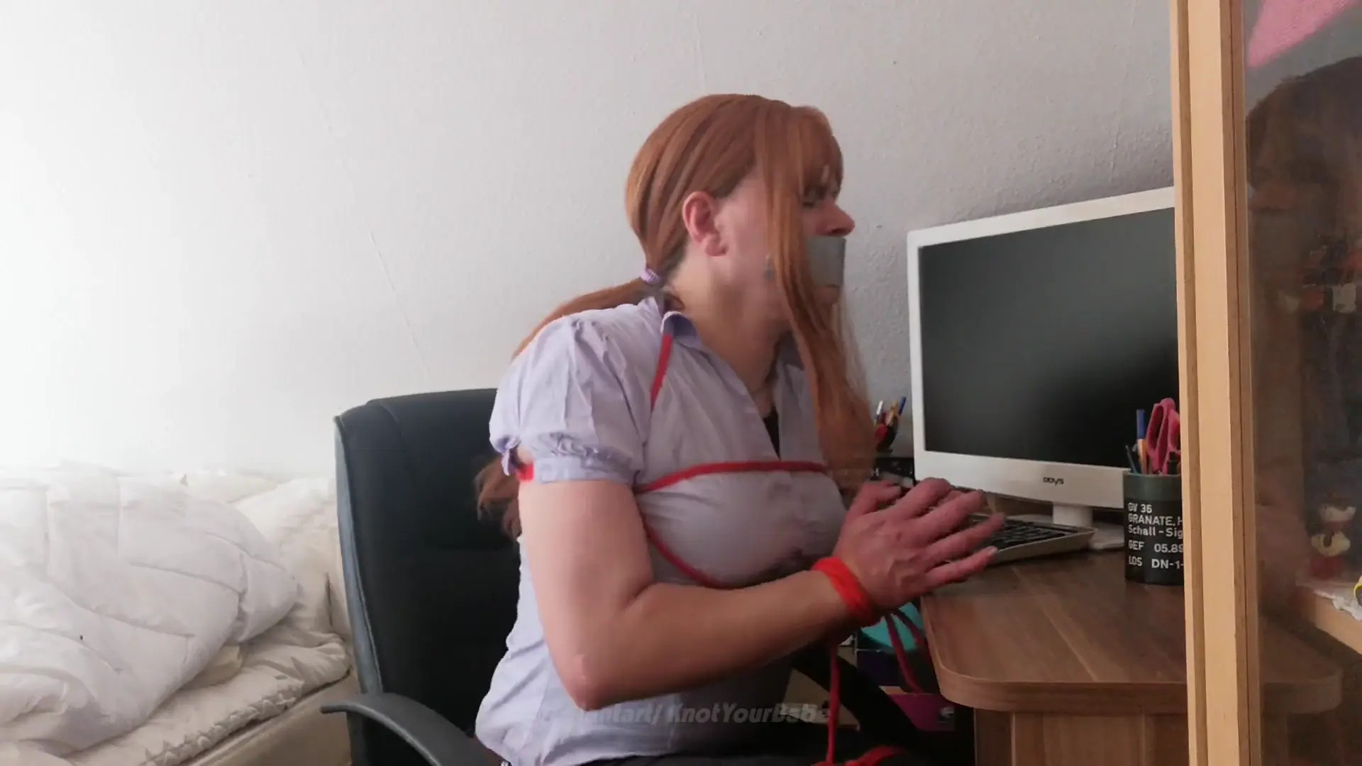 New Bondage Scene: Bound and Gagged Redhead Secretary reaches for Scissors - Stream & Download HD | BondageVid.com