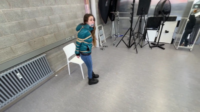 Rey bound and gagged in a shiny nylon Downjacket