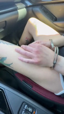Handcuffed girl in car