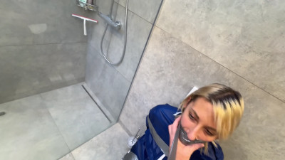 Myxxxy bound and gagged in the Bathroom in Rainwear