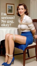 Mature woman tied tight on a chair