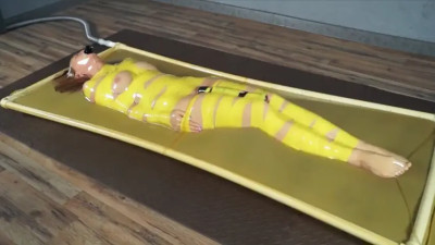 Girl gagged and trapped in vacuum bed