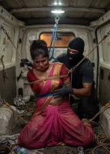 Indian women tied up in the back of the van