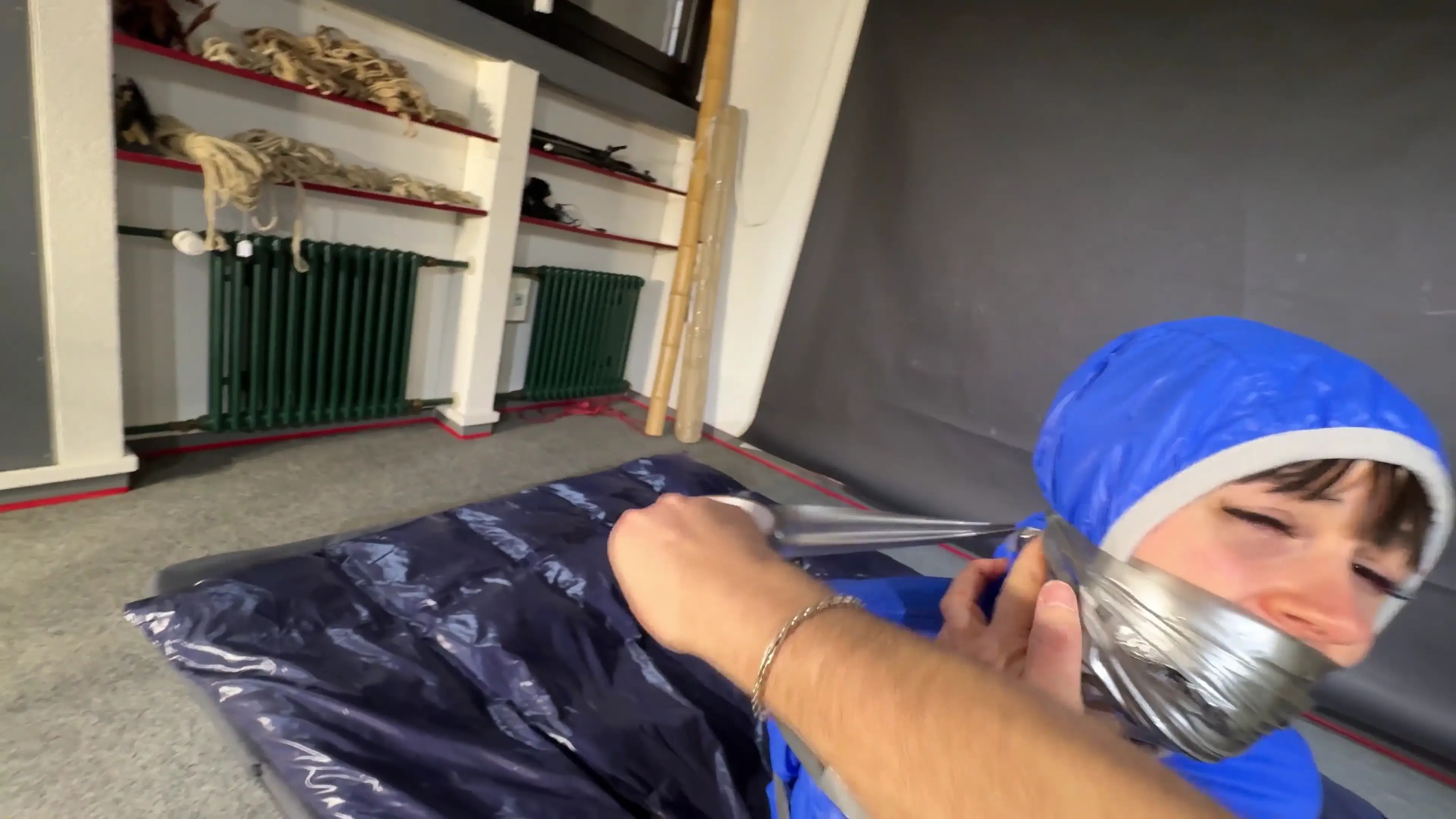 New Bondage Scene: Lanatied and gagged in shiny nylon Rainwear - Stream & Download HD | BondageVid.com
