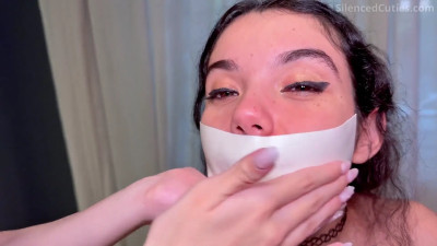 girl seals her friend's mouth